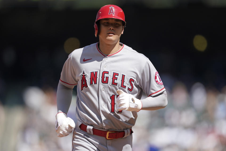 Los Angeles Angels' Shohei Ohtani runs to the dugout after being forced out at second during the seventh inning of a baseball game against the Seattle Mariners, Sunday, July 11, 2021, in Seattle. (AP Photo/Ted S. Warren)