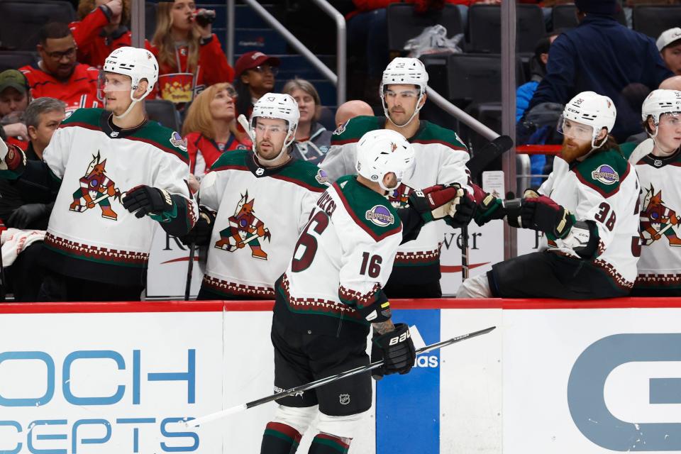 Arizona Coyotes left wing Jason Zucker (16) celebrates with teammates after scoring a goal against the Washington Capitals in the second period at Capital One Arena in Washington D.C. on March 3, 2024.