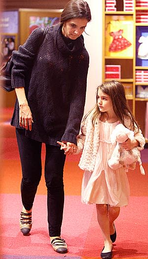 Katie Holmes and daughter Suri hit the American Girl store in New York City. Splash News