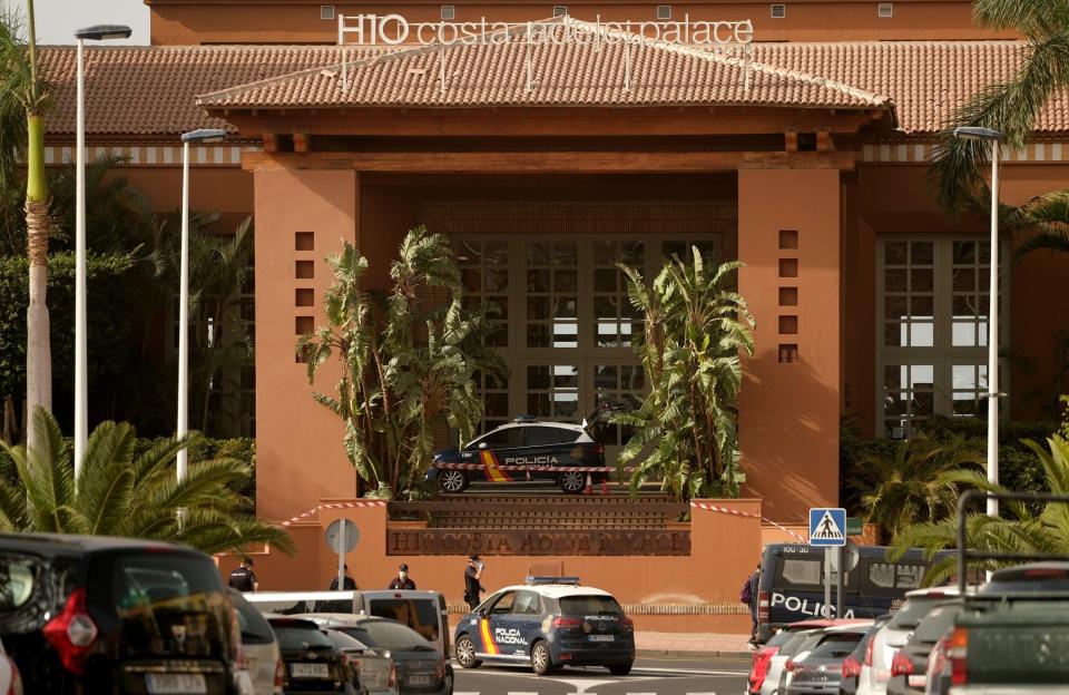 Spanish police officers stand outside the H10 Costa Adeje Palace hotel in Tenerife: AP