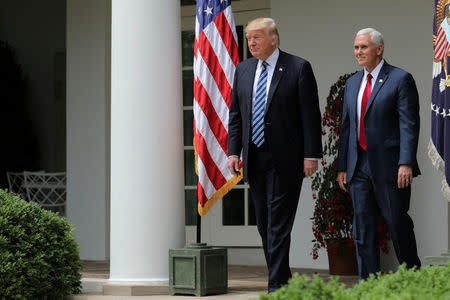 U.S. President Donald Trump and Vice President Mike Pence attend a National Day of Prayer event at the Rose Garden of the White House in Washington D.C., U.S., May 4, 2017. REUTERS/Carlos Barria