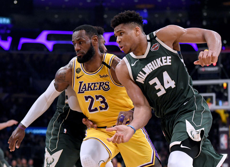 LeBron James and Giannis Antetokounmpo will lead the two top seeds into the Western and Eastern Conference playoffs. (Harry How/Getty Images)