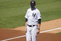 New York Yankees' Manager Aaron Boone stands on the field before a spring baseball game against the Toronto Blue Jays Sunday, Feb. 28, 2021, in Tampa, Fla. (AP Photo/Frank Franklin II)