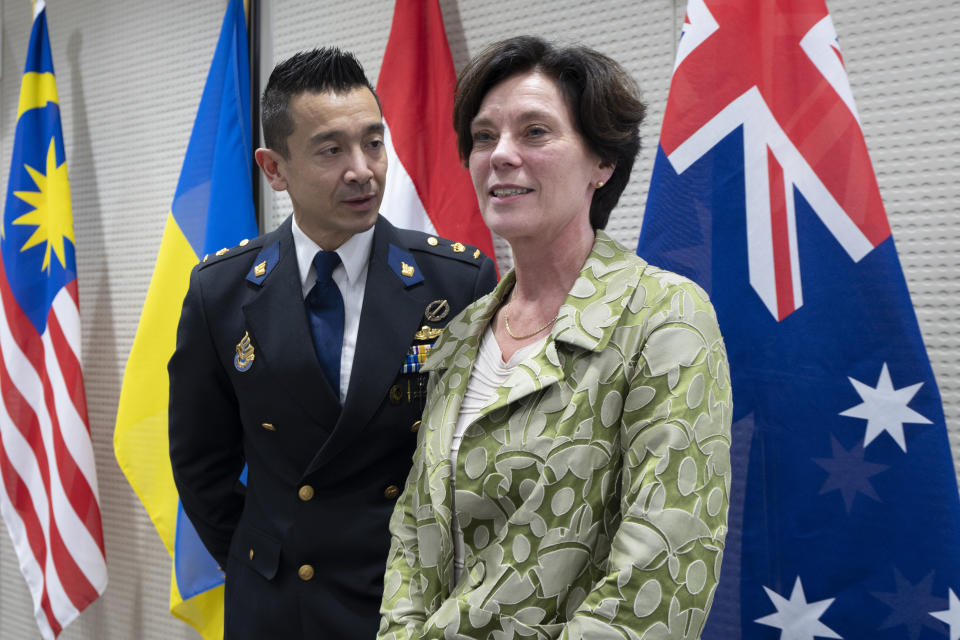 Prosecutor Digna van Boetzelaer, right, and Andy Kraag, Head of the National Criminal Investigations Division of the Netherlands, pose for the media after a news conference of the Joint Investigation Team, JIT, in The Hague, Netherlands, Wednesday, Feb. 8, 2023, on the results of the ongoing investigation into other parties involved in the downing of flight MH17 on 17 July 2014. The JIT investigated the crew of the Buk-TELAR, a Russian made rocket launcher, and those responsible for supplying this Russian weapon system that downed MH17. (AP Photo/Peter Dejong)