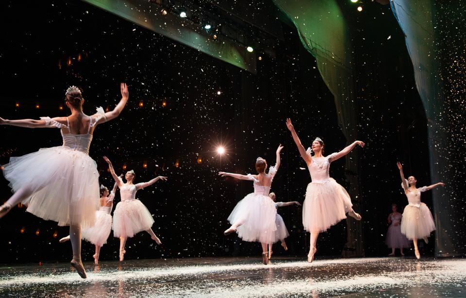 Snow seems to fall as dancers with the the Eugene Ballet rehearse for "The Nutcracker" at the Hult Center for the Performing Arts in Eugene.