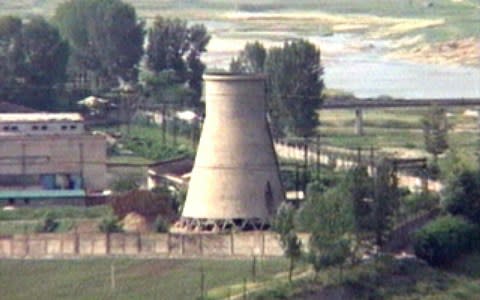 The 60-foot-tall cooling tower, which was later dismantled, is seen at the main Yongbyon nuclear reactor complex - Credit: AP