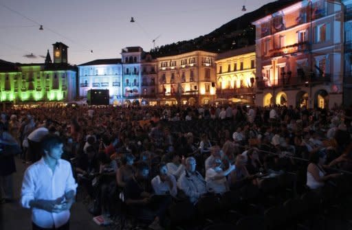 Spectators are seated in front of the giant screen at the Piazza Grande during the 62nd Locarno International Film Festival in 2009. French actress Jeanne Moreau lights up the big screen at the Locarno Film Festival Saturday in a film inspired by a story of friendship between two Estonian women in Paris