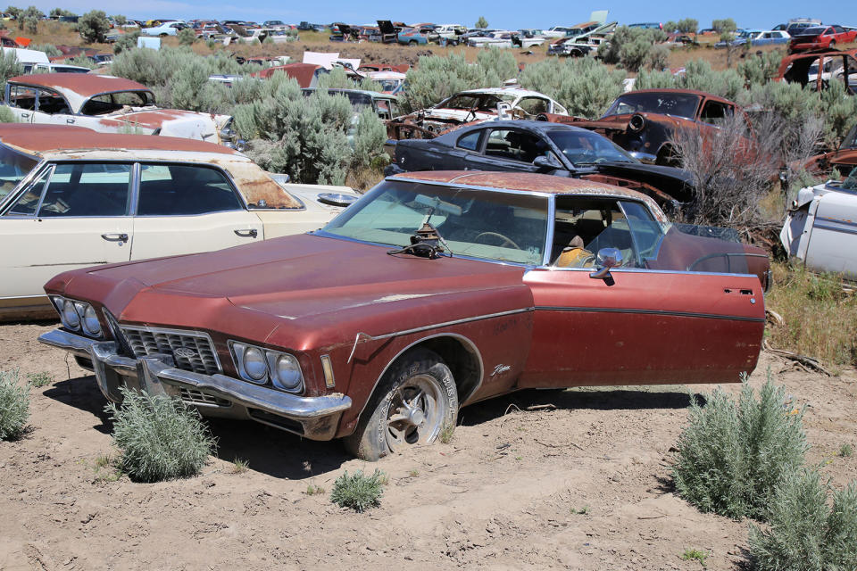 <p>While some salvage yards are fastidious about ensuring that doors and trunk lids are always closed, it doesn’t seem to be a priority at L&L Classic Auto. This 1972 Buick ‘boattail’ Riviera’s driver’s door has probably been open for years, which explains why the seat has been totally destroyed. </p><p>We wonder how many years it has sat in this same spot to have sunk this deep into the Idaho dirt.</p>