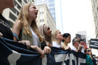 <p>Demonstrators protest the Trump administration’s immigration policies as part of a “Families Belong Together” rally in Houston, Texas, June 30, 2018. (Photo: Loren Elliott/Reuters) </p>