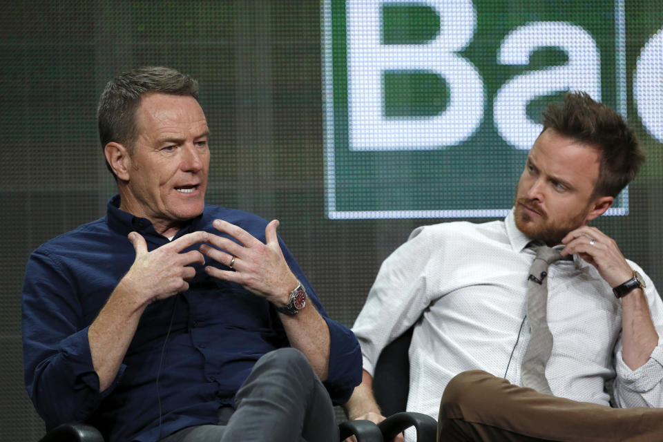 Cast member Bryan Cranston (L) speaks next to co-star Aaron Paul at a panel for the television series "Breaking Bad" during the AMC portion of the Television Critics Association Summer press tour in Beverly Hills, California July 26, 2013.   REUTERS/Mario Anzuoni  (UNITED STATES - Tags: ENTERTAINMENT)