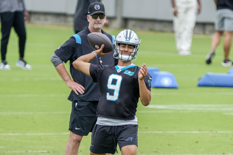 Jun 14, 2023; Charlotte, NC, USA; Carolina Panthers head coach Frank Reich watches quarterback <a class="link " href="https://sports.yahoo.com/nfl/players/40029" data-i13n="sec:content-canvas;subsec:anchor_text;elm:context_link" data-ylk="slk:Bryce Young;sec:content-canvas;subsec:anchor_text;elm:context_link;itc:0">Bryce Young</a> (9) during the Carolina Panthers minicamp. Mandatory Credit: Jim Dedmon-USA TODAY Sports