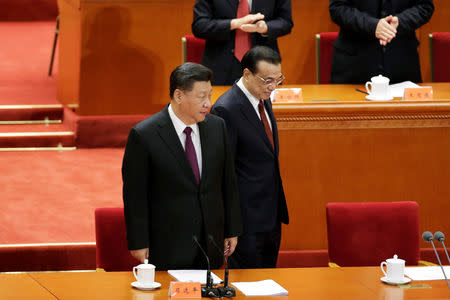 Chinese President Xi Jinping and Premier Li Keqiang arrive for an event marking the 40th anniversary of China's reform and opening up at the Great Hall of the People in Beijing, China December 18, 2018. REUTERS/Jason Lee