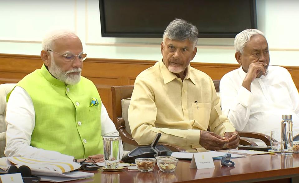 In this screen grab taken from a video uploaded on the official YouTube channel of Indian prime minister Narendra Modi, the prime minister, left, is sitting next to Telugu Desam Party leader N Chandrababu Naidu, center, and Janata Dal (United) leader Nitish Kumar during a meeting at the prime minister’s residence in New Delhi, India, Wednesday, 5 June 2024 (AP)