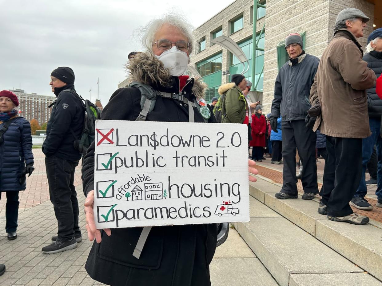 Cecile Wilson was one of dozens who gathered outside city hall to tell councillors Lansdowne 2.0 should not be a top priority. (Elyse Skura/CBC - image credit)