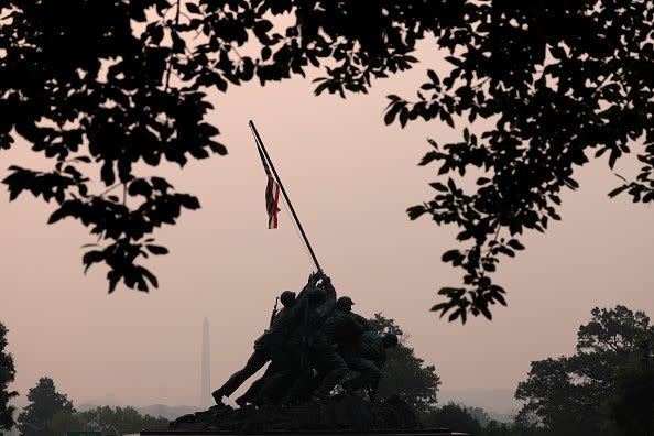 ARLINGTON, VIRGINIA - JUNE 07: Hazy skies caused by Canadian wildfires blanket the monuments and skyline of Washington, DC on June 7, 2023 as seen from Arlington, Virginia. The Washington DC area is under a Code Orange air quality alert indicating unhealthy air for some members of the general public.  (Photo by Win McNamee/Getty Images)