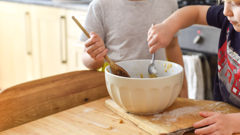 Parent and child making cookies