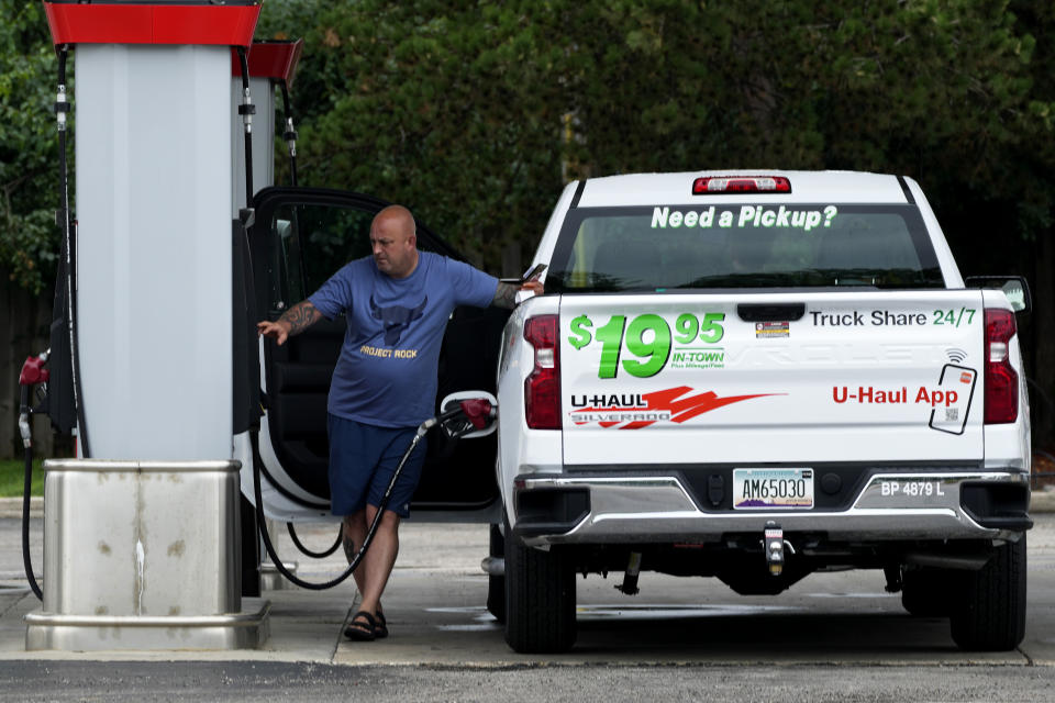 A man fills up with gasoline at a gas station in Morton Grove, Illinois, Wednesday, July 10, 2024. (AP Photo/Nam Y. Huh)