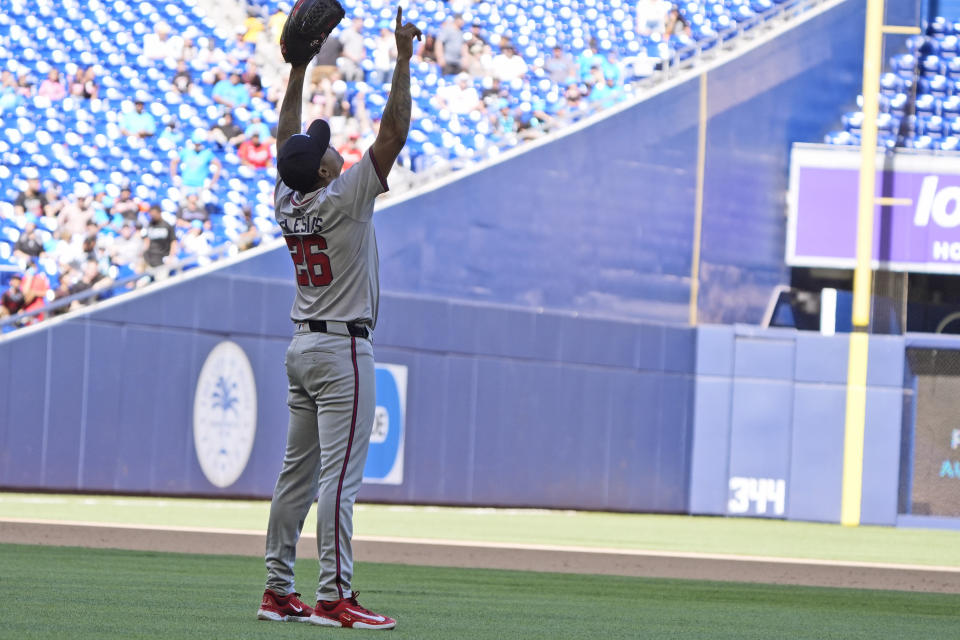 Atlanta Braves relief pitcher Raisel Iglesias celebrates after the Braves beat the Miami Marlins 9-7, in a baseball game, Sunday, April 14, 2024, in Miami. (AP Photo/Wilfredo Lee)