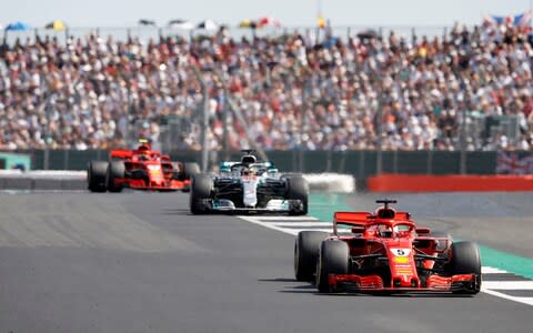 Ferrari's Sebastian Vettel (right), Mercedes' Lewis Hamilton and Ferrari's Kimi Raikkonen during the 2018 British Grand Prix at Silverstone Circuit, Towcester. PRESS ASSOCIATION Photo - Credit: PA