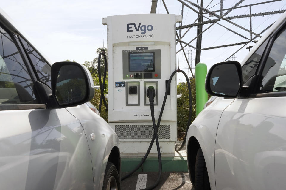 FILE - Electric cars are parked at a charging station in Sacramento, Calif., Wednesday, April 13, 2022. California air regulators will take public comment Thursday, June 23 2022, on a plan to slash fossil fuel use and reach carbon neutrality by 2045. (AP Photo/Rich Pedroncelli, File)