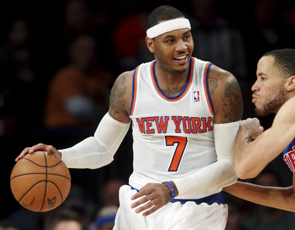 New York Knicks' Carmelo Anthony (7) is guarded by Detroit Pistons' Tayshaun Prince during the second half of an NBA basketball game in New York, Sunday, Nov. 25, 2012. The Knicks won 121-100. (AP Photo/Seth Wenig)