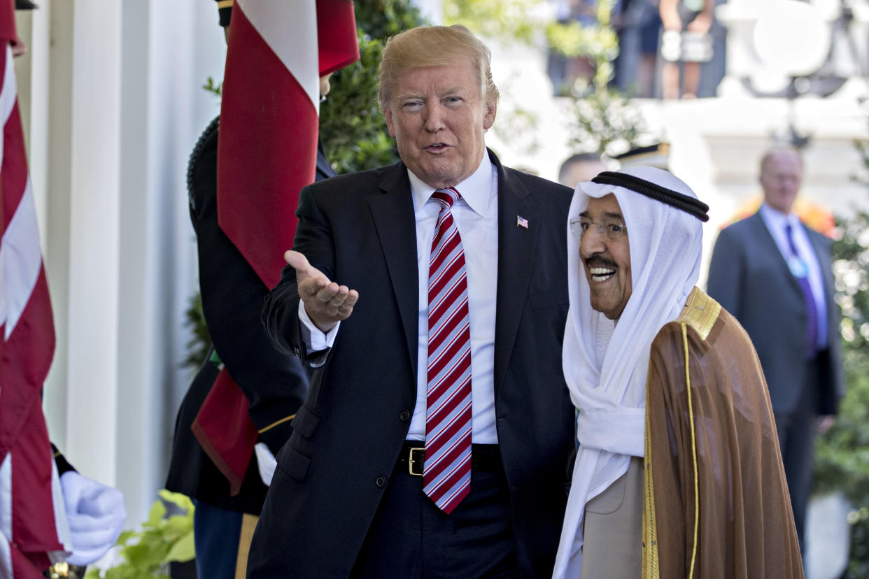 President Trump gestures at photographers while greeting Sheikh Sabah Al-Ahmad Al-Sabah, Kuwait’s emir, at the West Wing of the White House in 2017. (Photo: Andrew Harrer/Bloomberg via Getty Images)