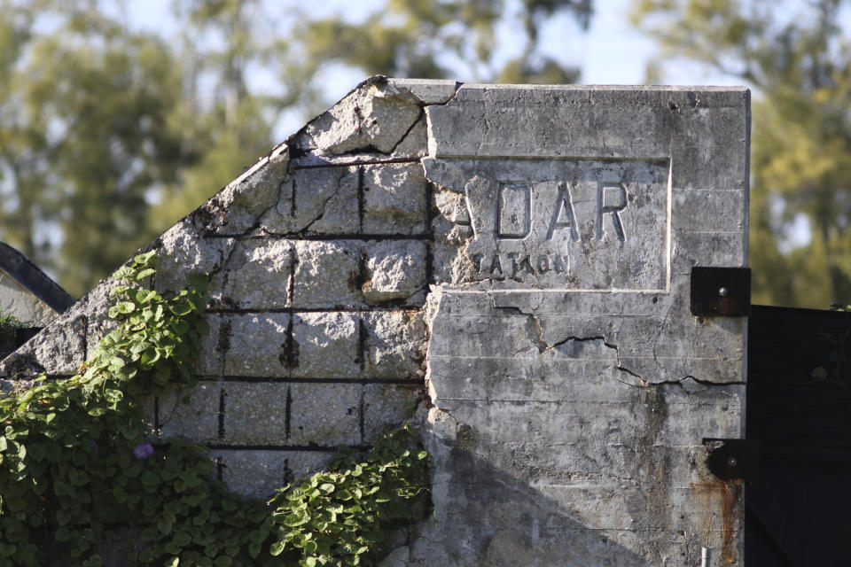 In this Tuesday, Oct. 15, 2019 photo, a damaged World War II radar station is shown on Midway Atoll in the Northwestern Hawaiian Islands. Deep-sea explorers scouring the world's oceans for sunken World War II ships are honing in on a debris field deep near Midway in the Pacific. A research vessel called the Petrel is launching underwater robots about halfway between the U.S. and Japan in search of warships from the Battle of Midway. (AP Photo/Caleb Jones)