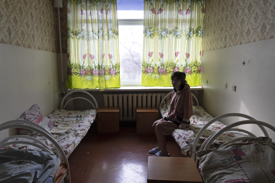 Natalia, 37, a patient, sits in her room at a psychiatric hospital in Kramatorsk, Ukraine, Tuesday March 21, 2023. In December, the World Health Organization said one in five people in countries that have experienced conflict in the past decade will suffer from a mental health condition, and estimated that about 9.6 million people in Ukraine could be affected. Russia’s invasion in February 2022 resulted in millions of people being displaced, bereaved, forced into basements for months due to incessant shelling or enduring harrowing journeys from Russian-occupied regions. (AP Photo/Vasilisa Stepanenko)