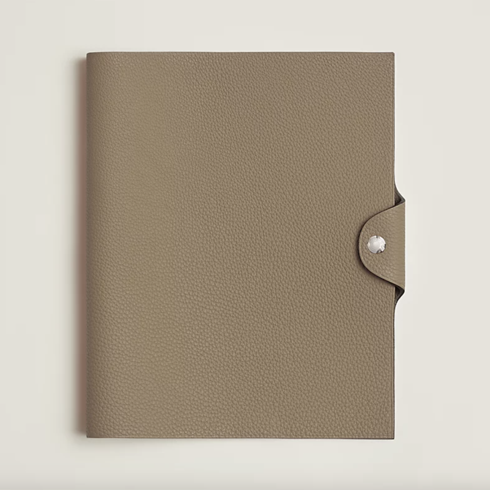 <p><a href="https://www.hermes.com/us/en/product/ulysse-mm-notebook-cover-H036987CK8Q/" rel="nofollow noopener" target="_blank" data-ylk="slk:Shop Now;elm:context_link;itc:0;sec:content-canvas" class="link ">Shop Now</a></p><p>Ulysse MM Notebook Cover</p><p>hermes.com</p><p>$395.00</p>