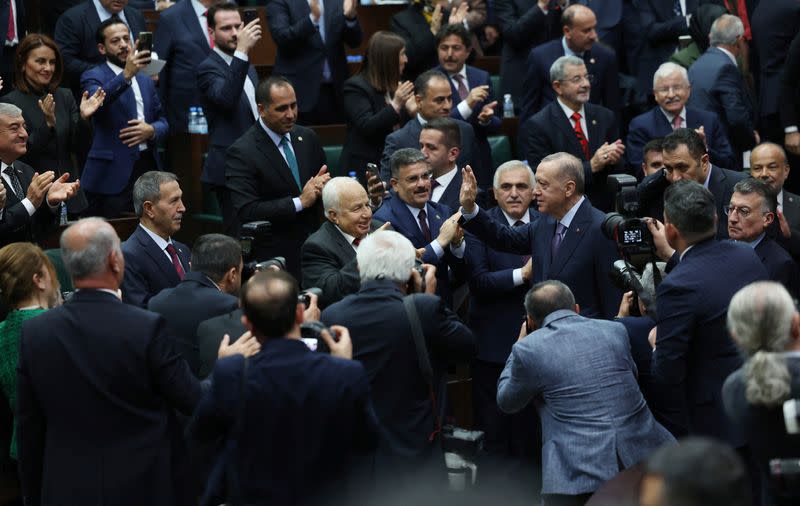 Turkey's President Tayyip Erdogan greets members of parliament in Ankara