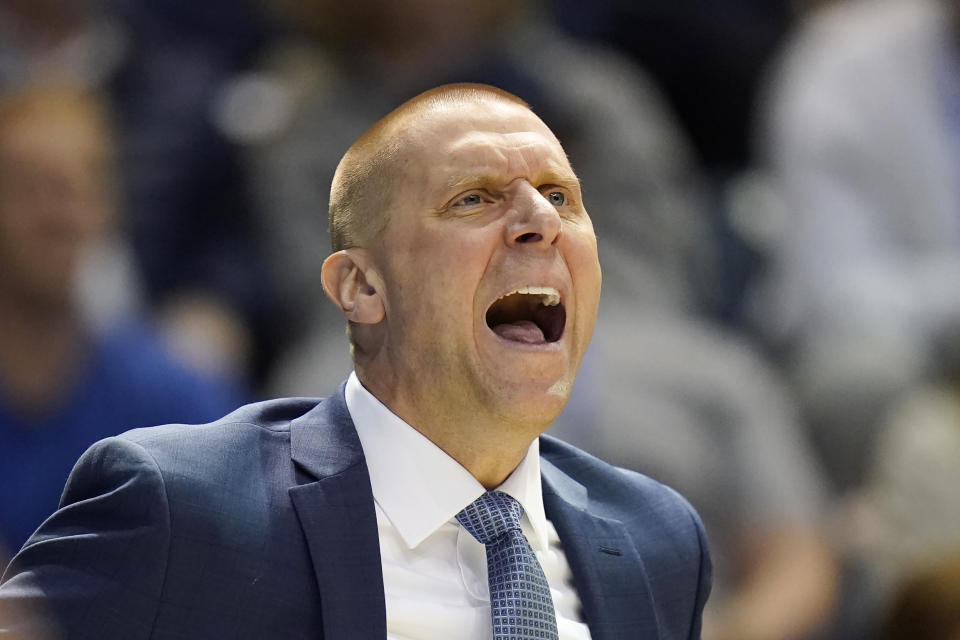 BYU coach Mark Pope shots to players during the first half of an NCAA college basketball game against Cincinnati on Saturday, Jan. 6, 2024, in Provo, Utah. (AP Photo/Rick Bowmer)