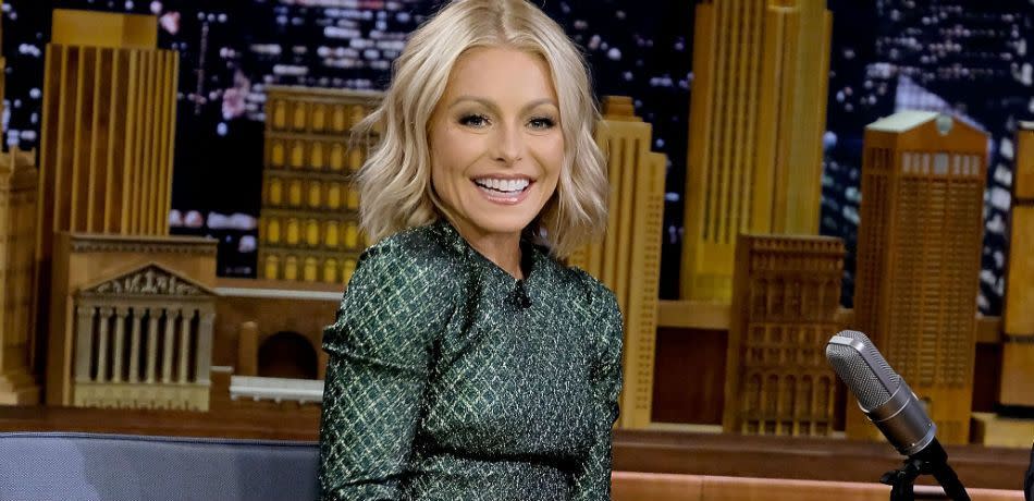 Kelly Ripa smiles on set