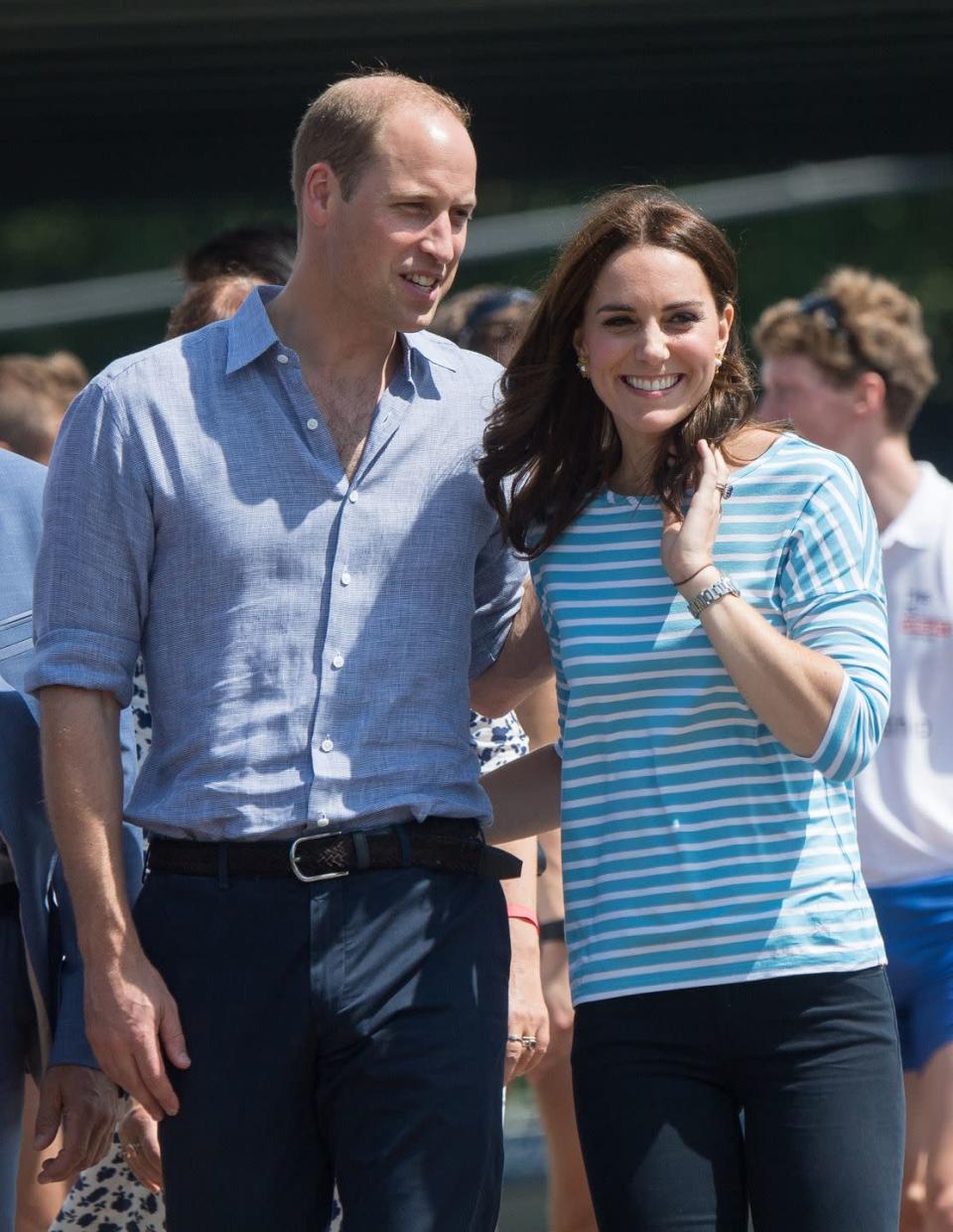 <p>The Duke and Duchess of Cambridge wrapped their arms around each other's waists after taking part in a rowing race between the twinned town of Cambridge and Heidelberg during their official visit to Poland and Germany, July 2017. </p>