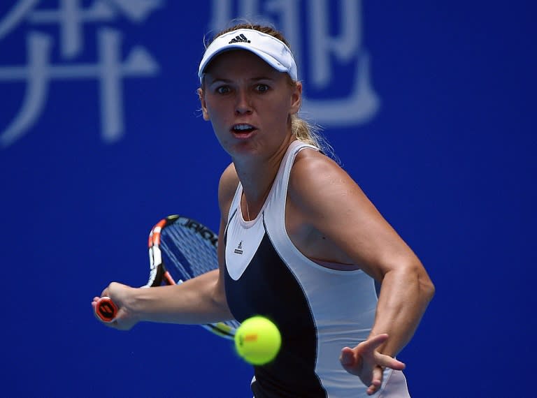 Defeat for Denmark's Caroline Wozniacki at the China Open ended her hopes of reaching the WTA Finals