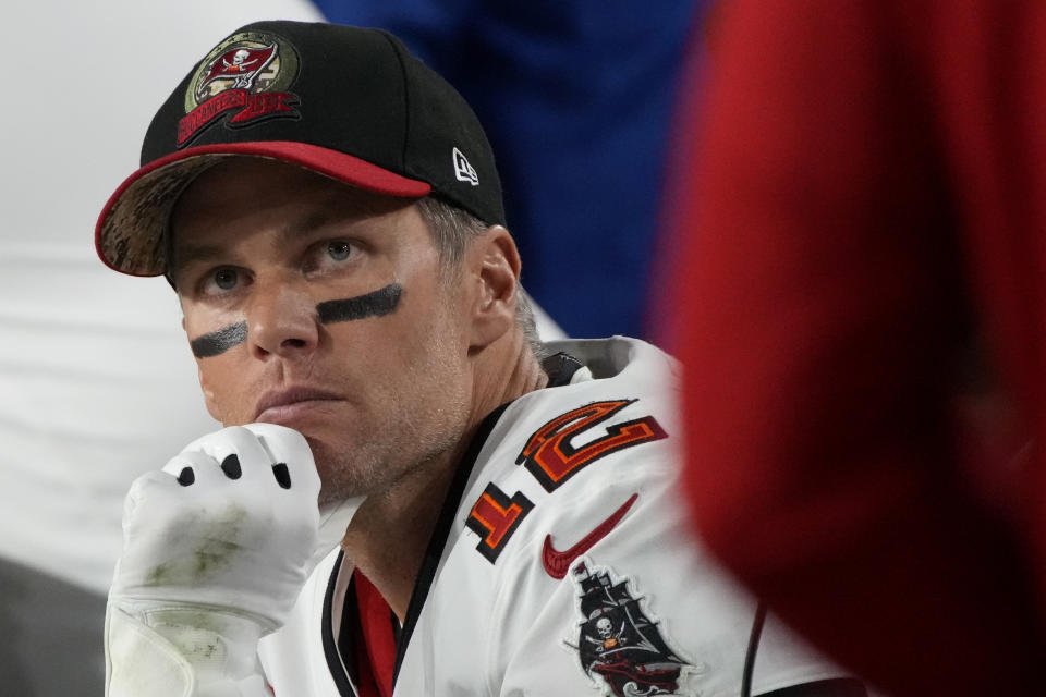 Tampa Bay Buccaneers quarterback Tom Brady (12) watches from the sideline against the Arizona Cardinals during the second half of an NFL football game, Sunday, Dec. 25, 2022, in Glendale, Ariz. (AP Photo/Rick Scuteri)