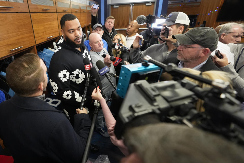 Tennessee Titans defensive tackle Jeffrey Simmons, left, responds to questions from reporters at the NFL football team's training facility, Monday, Jan. 8, 2024, in Nashville, Tenn. (AP Photo/George Walker IV)