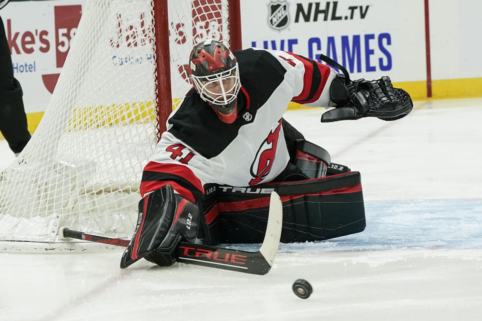 New Jersey Devils goaltender Scott Wedgewood stops a shot during the second period of the team's NHL hockey game against the New York Islanders on Thursday, Jan. 21, 2021, in Uniondale, N.Y. (AP Photo/Frank Franklin II)