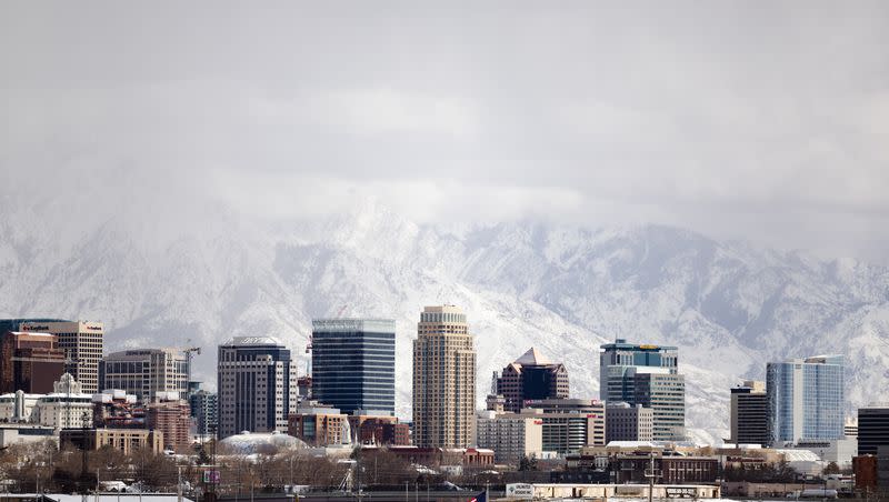 The Salt Lake City downtown skyline is seen after a snowstorm in Salt Lake City on Friday, March 24, 2023. Utah has achieved a record-breaking snowfall total this winter, according to the National Weather Service.