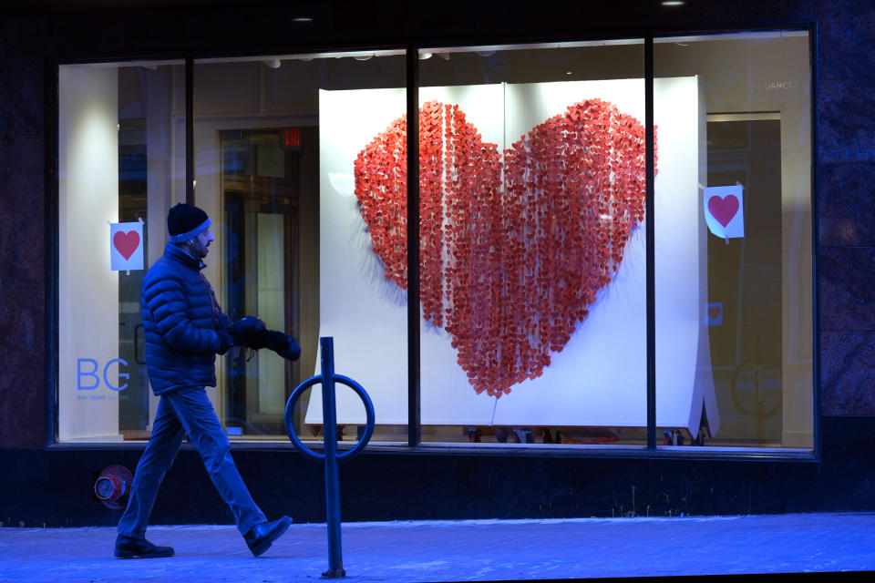 A large Valentine's Day heart is displayed at the Maine College of Art, Wednesday, Feb. 14, 2024, in Portland, Maine. The public has helped honor the memory of Kevin Fahrman, the Valentine's Day Bandit who secretly hung hundreds of red paper hearts throughout the city every February 14th. Farman died last year. (AP Photo/Robert F. Bukaty)