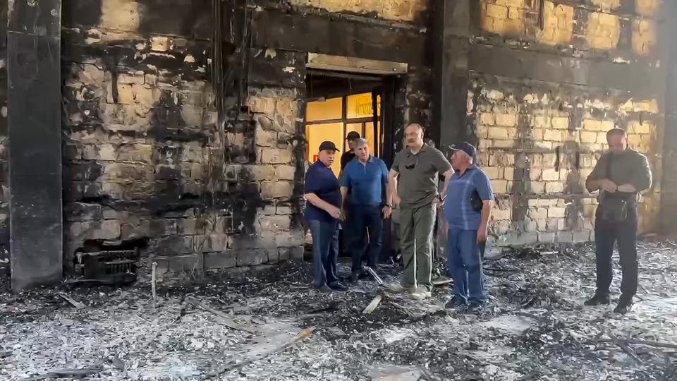 FILE - In this photo taken from video released by The Telegram Channel of the head of Dagestan Republic of Russia on Monday, June 24, 2024, Dagestan Gov. Sergei Melikov, center, visits the damaged Kele-Numaz synagogue in Derbent, Russia. Jews in the predominantly Muslim region of Dagestan in southern Russia say they are determined to regroup and rebuild following a deadly attack by Islamic militants on June 23 on Christian and Jewish houses of worship in Derbent and the regional capital of Makhachkala. (The Telegram Channel of the head of Dagestan Republic of Russia via AP, File)