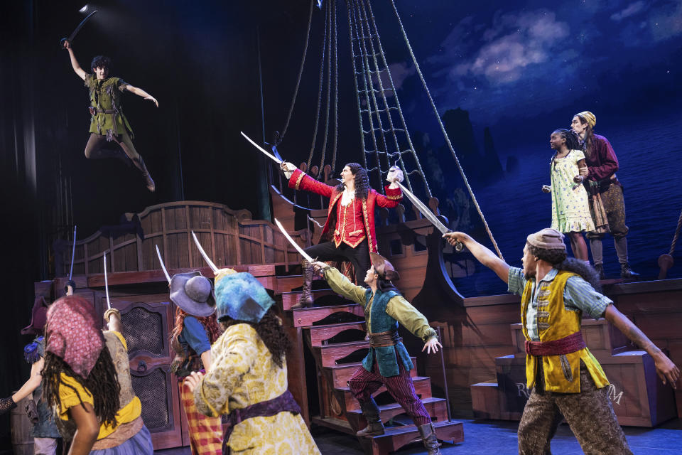 This image released by Bond Theatrical shows Nolan Almeida as Peter Pan, and the cast during a performance of an inclusive stage production of “Peter Pan.” The touring production kicks off in Maryland on Feb. 21 and travels to North Carolina, Ohio, Illinois, Washington, D.C., South Carolina, Florida, Arizona, Nevada, California, Missouri, Texas and Georgia. (Matthew Murphy/Bond Theatrical via AP)