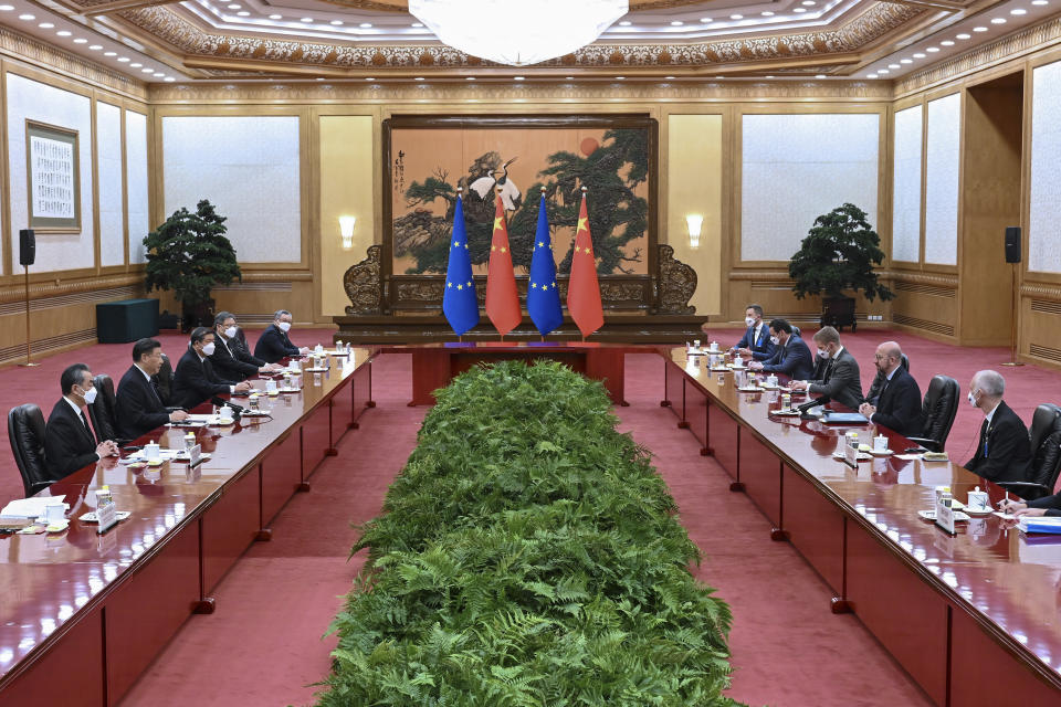 In this photo released by Xinhua News Agency, Chinese President Xi Jinping, second from left, speaks during a meeting with European Council President Charles Michel at the Great Hall of the People in Beijing, Thursday, Dec. 1, 2022. (Zhang Ling/Xinhua via AP)