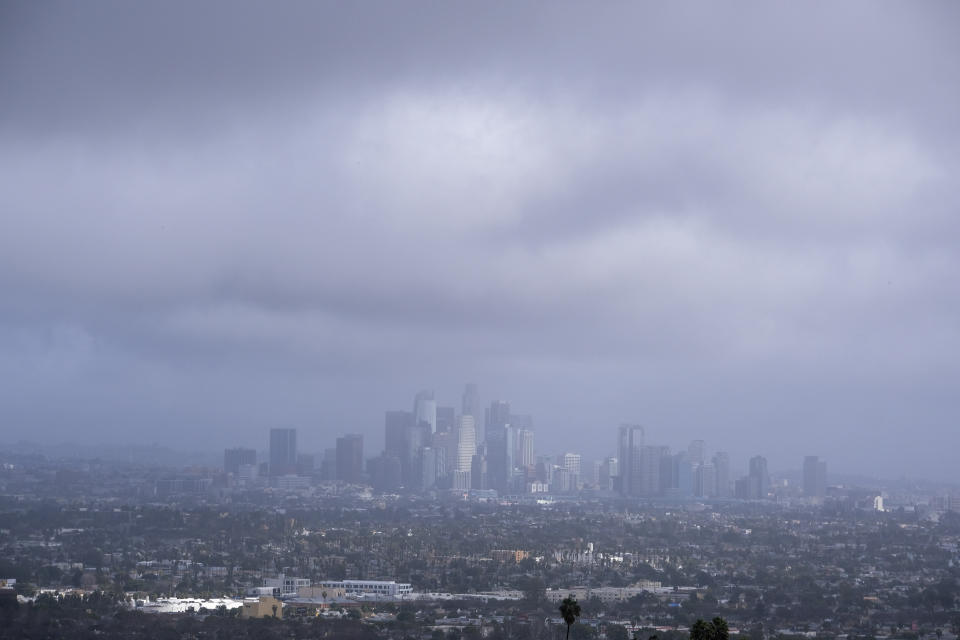 Storm clouds blanket the Los Angeles skyline is seen at Kenneth Hahn State Recreation Area following a rainstorm in Los Angeles, Thursday, Jan. 5, 2023. (AP Photo/Ringo H.W. Chiu)