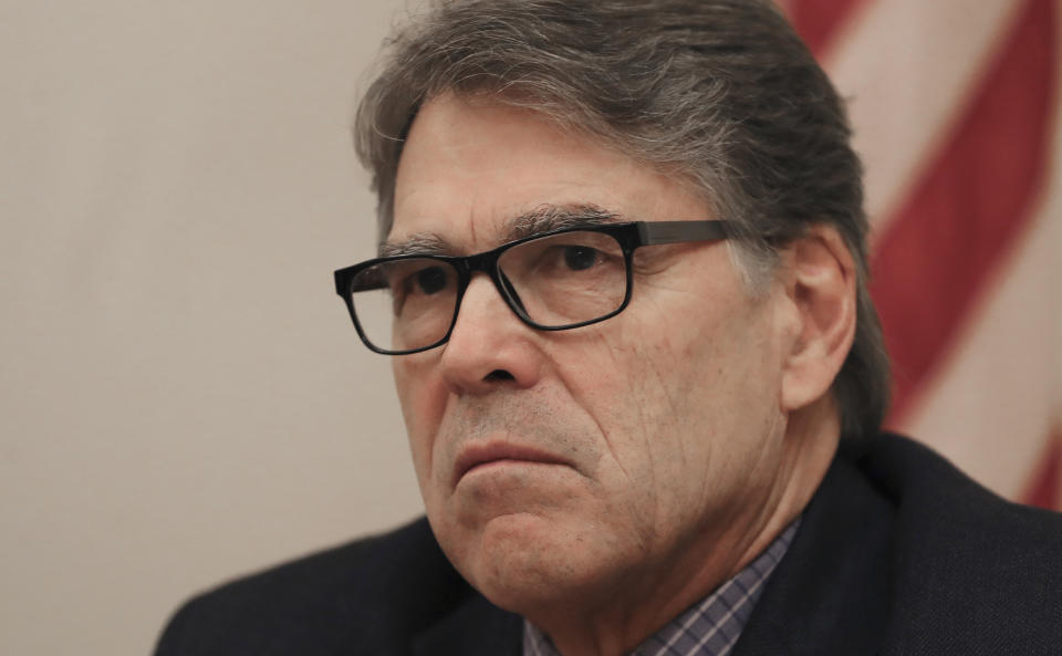 The outgoing U.S. Energy Secretary Rick Perry talks to the journalists during a roundtable presser in Dubai, United Arab Emirates, Saturday, Oct. 26, 2019. (AP Photo/Kamran Jebreili)