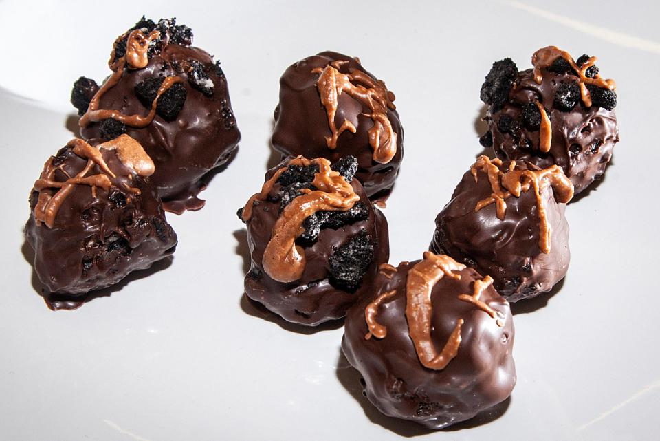 Chocolate cookie balls, topped with a drizzle of melted Reese's Peanut Butter cups, made by photojournalist Joseph Cress.