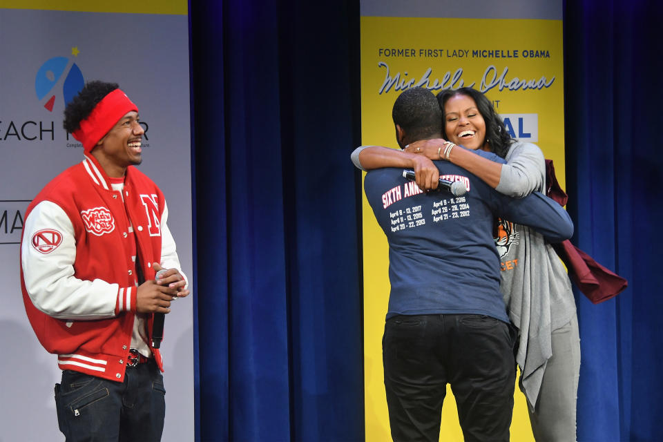 NEW YORK, NY - MAY 05:  Former First Lady Michelle Obama hugs a student onstage during MTV's 2017 College Signing Day With Michelle Obama at The Public Theater on May 5, 2017 in New York City.  (Photo by Mike Coppola/Getty Images for MTV)