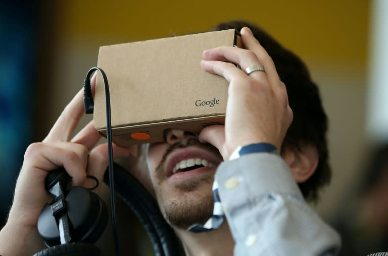 An attendee inspects Google Cardboard during the 2015 Google I/O conference in San Francisco, California