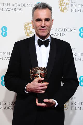 <p>Ian West/PA Images</p> Daniel Day-Lewis with his best leading actor trophy for <em>Lincoln</em> in the press room at the 2013 British Academy Film Awards