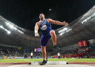 Joe Kovacs, of the United States, competes in the men's shot put final to win the championship record for gold at the World Athletics Championships in Doha, Qatar, Saturday, Oct. 5, 2019. (AP Photo/David J. Phillip)