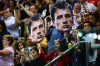 Fans hold giant placards of US swimmer Ryan Lochte during the medal ceremony for the men's 200m individual medley swimming event at the London 2012 Olympic Games in London. Lochte's London Olympics ended with a whimper on Thursday as a brutal backstroke-medley double failed to yield gold and he succumbed yet again to old foe Michael Phelps